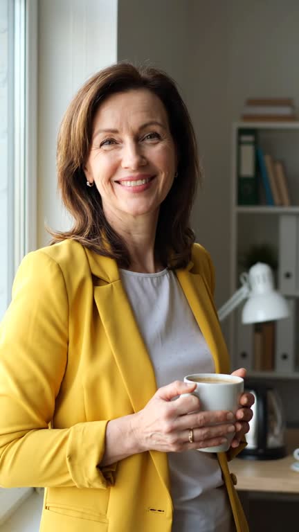 Natural style: a woman with a coffee mug in a home office